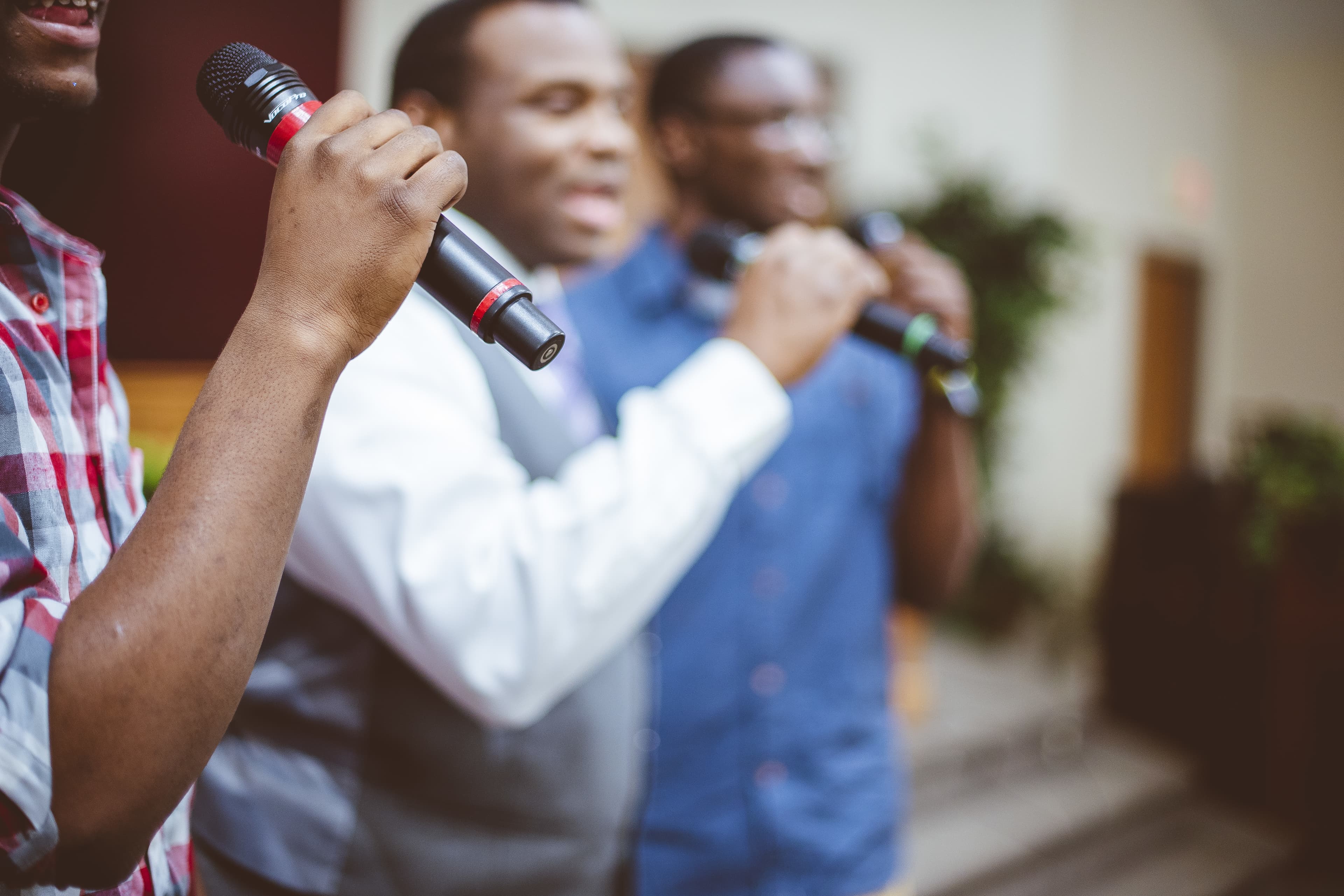 Men singing worship at church